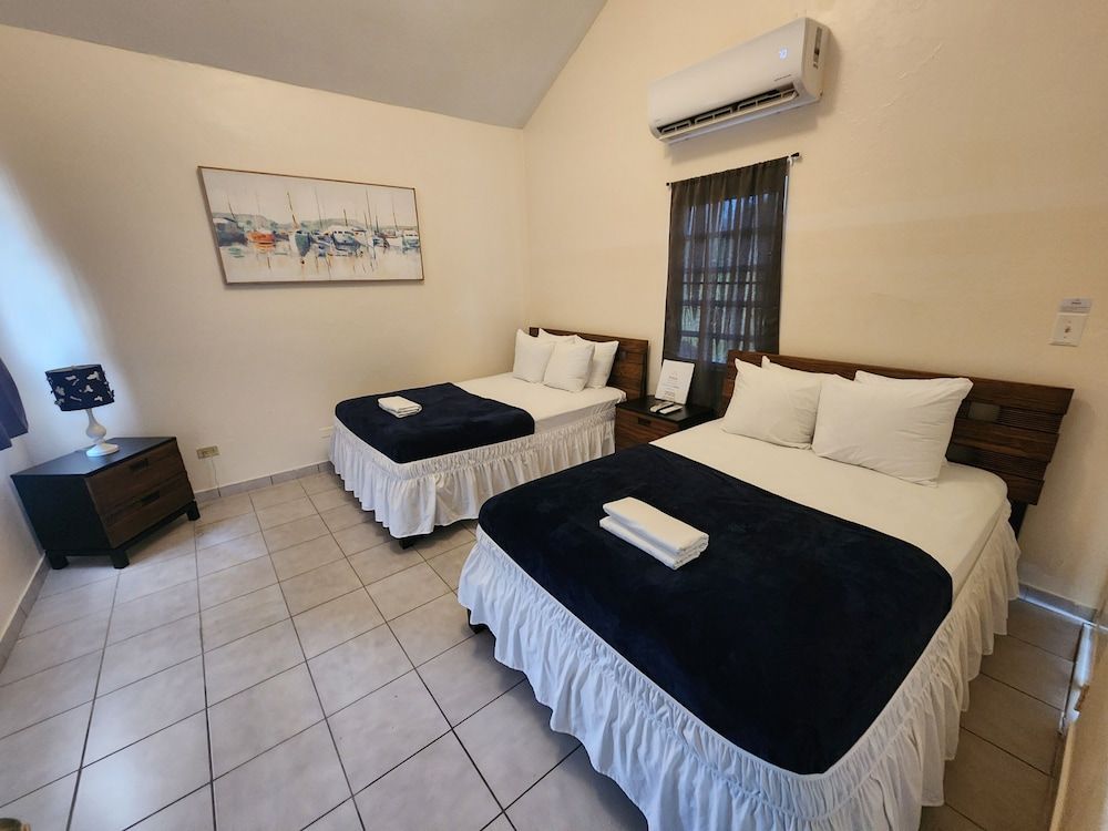 Classic Quadruple Room, 2 Queen Beds, Pool View