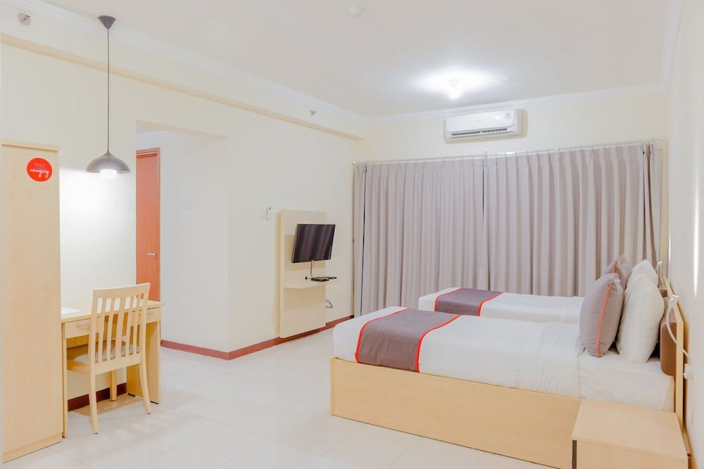 Collection O 6 Grand Palace Kemayoran Deluxe Twin Room