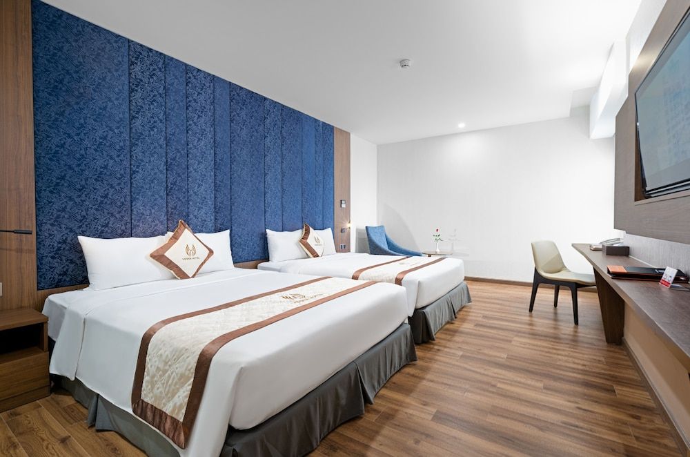 Deluxe Quadruple Room, 2 Queen Beds, Partial Sea View