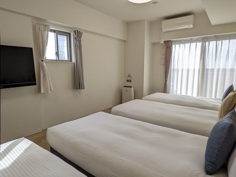 Deluxe Quadruple Room, Multiple Beds, Non Smoking, City View