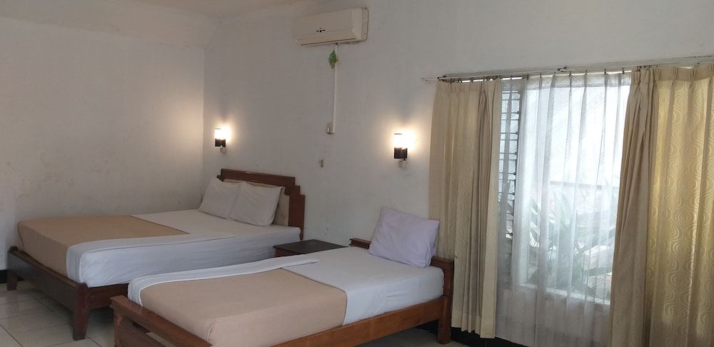 Intan Hotel Purwakarta Family Triple Room 2