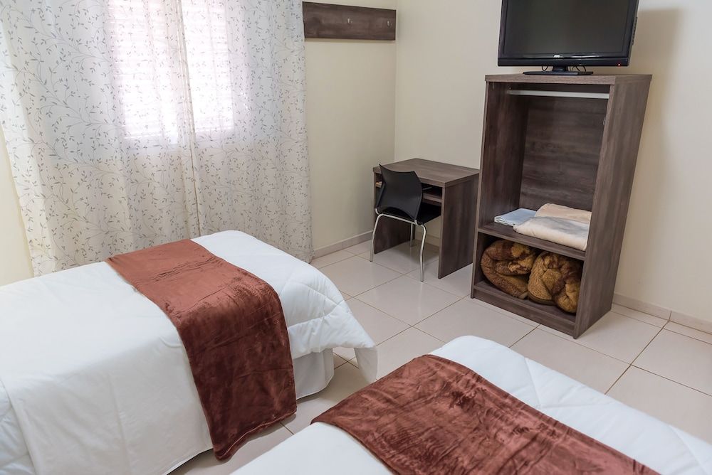 Hotel D'Napoles Twin Room, Multiple Bedrooms