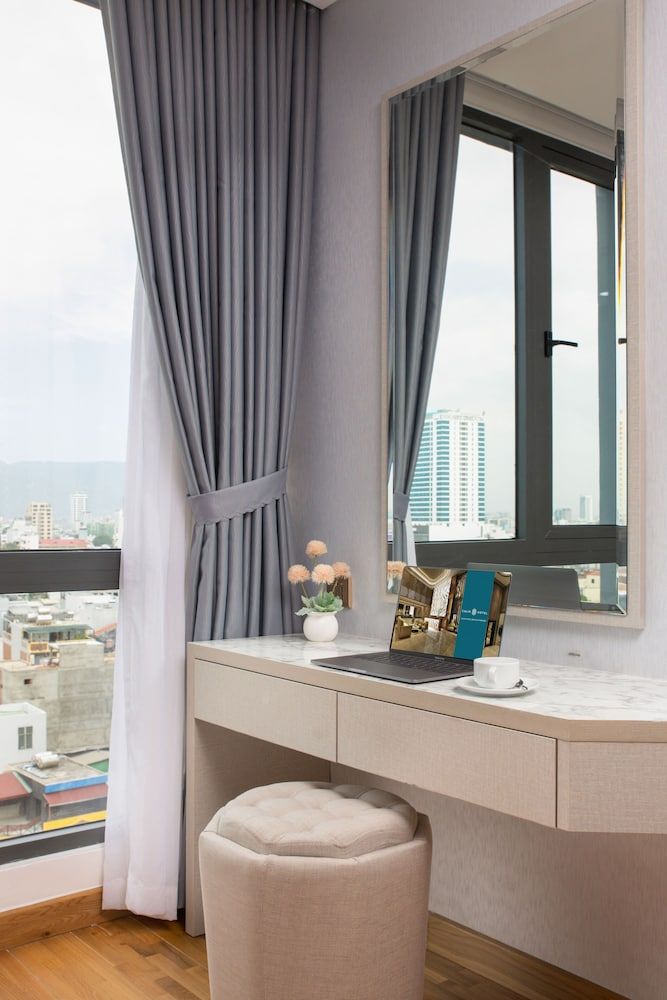 Calix Hotel Da Nang Beach Deluxe Triple Room 6