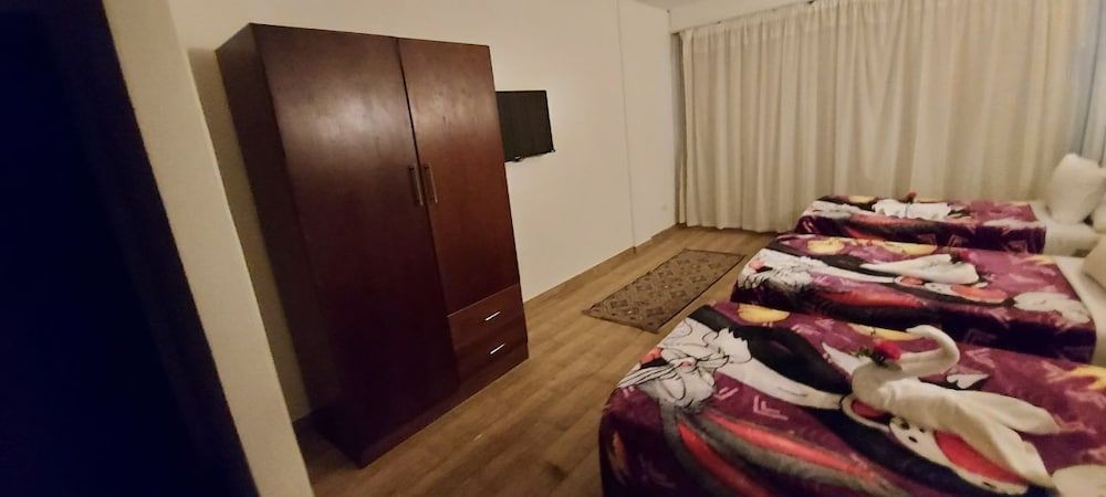 Wassim Boutique Deluxe Triple Room with Garden View 9