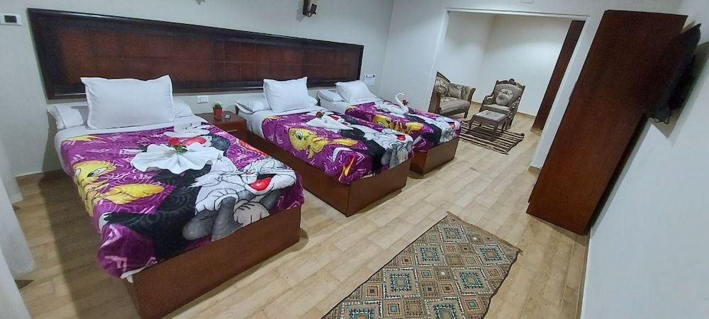 Wassim Boutique Deluxe Triple Room with Garden View 7