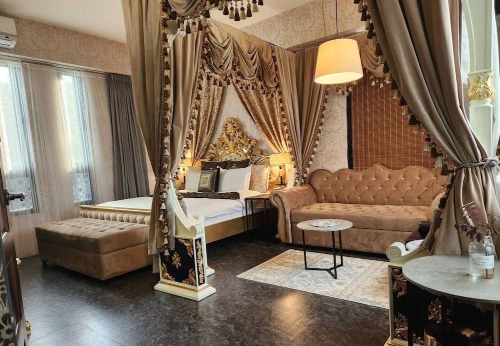 Deluxe Quadruple Room, 1 King Bed with Sofa bed, Bathtub, Garden View(No pets allowed)