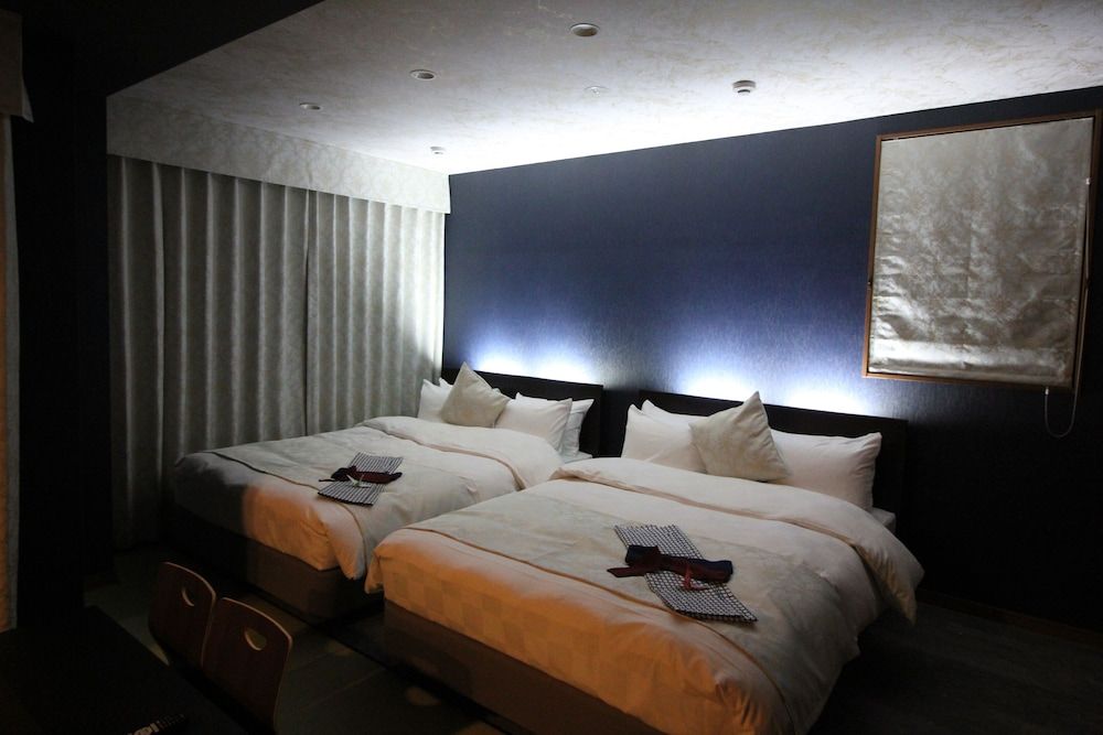 Weskii Hotel Deluxe Twin Room with Two Double Bed, 50%off on the second night of their stay