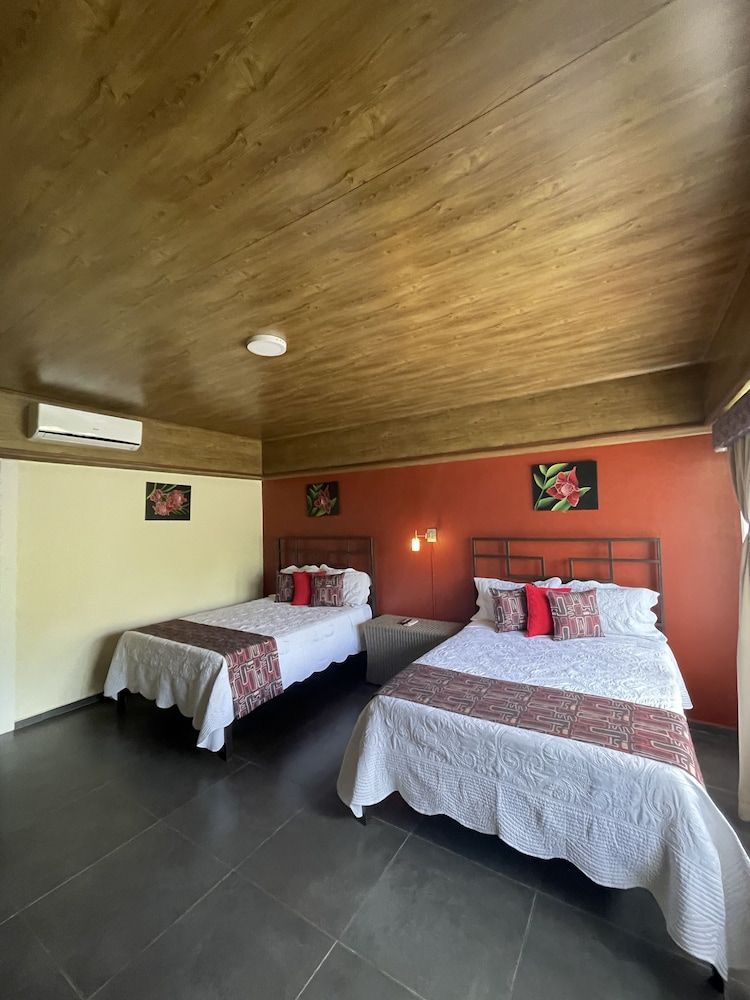 Campos Arenal Hotel Deluxe Quadruple Room, 2 Double Beds, Garden View 5
