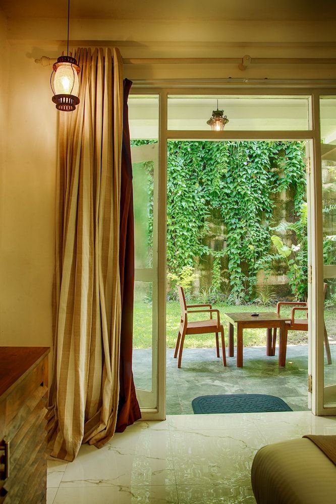 Deltora Boutique Hotel Deluxe Double Room, 1 King Bed, Patio, Garden View 5