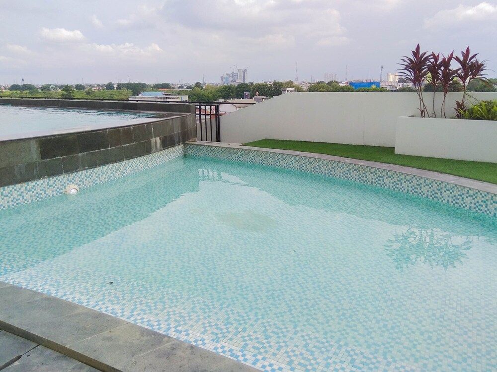 Comfortable Patraland Urbano Studio Apartment Near Train Station