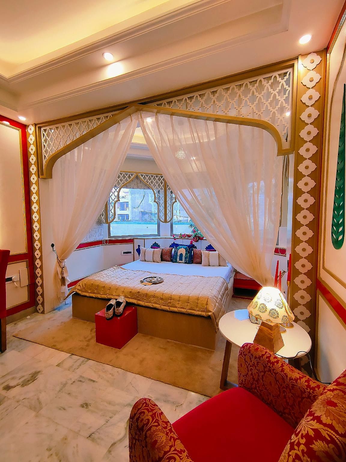 Mughal heritage room with 180 degree city view from Designer bed