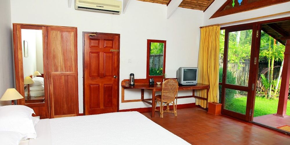 Abad Whispering Palms Cottage with Garden View 8