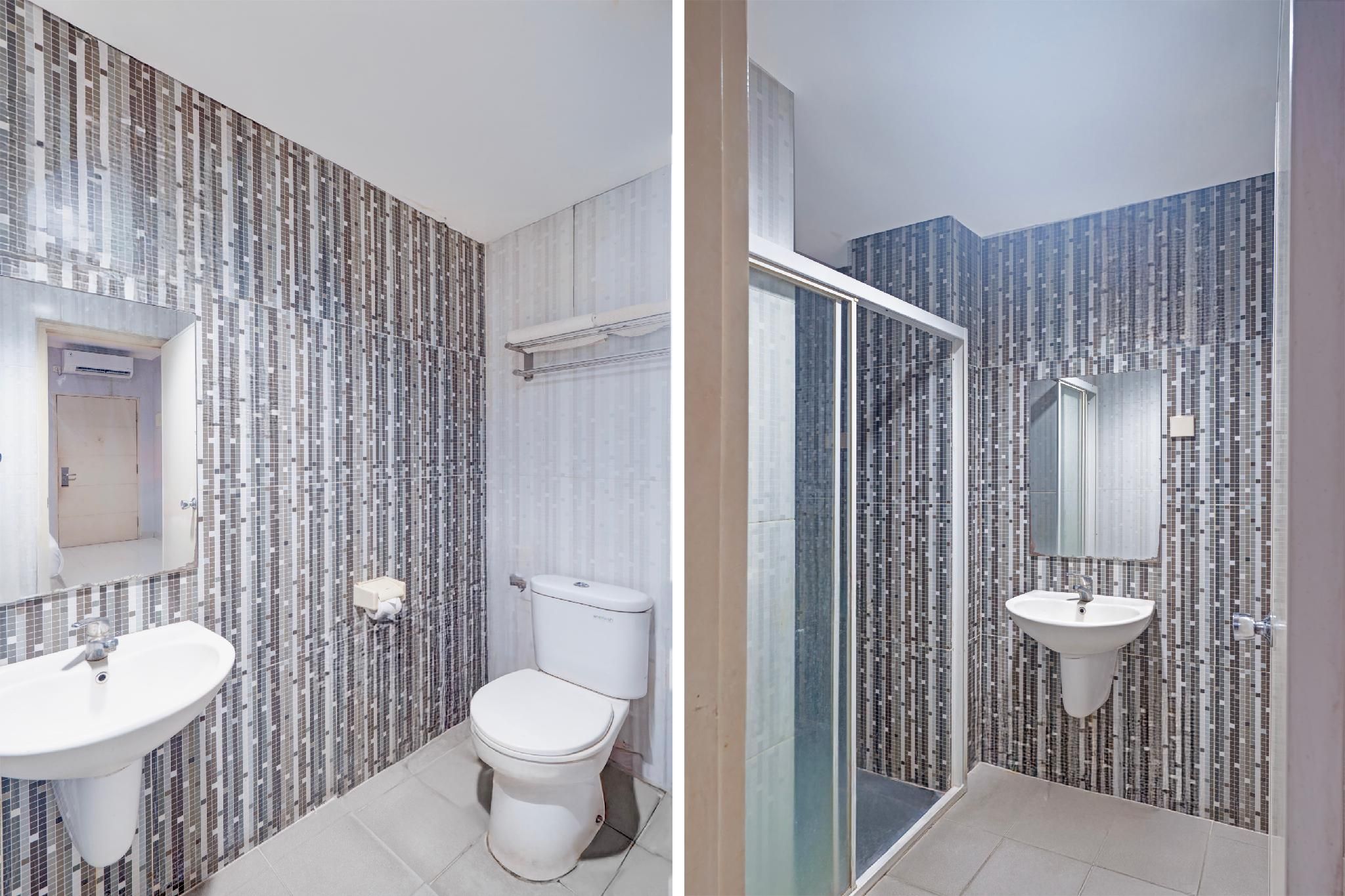 Collection O Hotel Antara Deluxe Twin Room 8