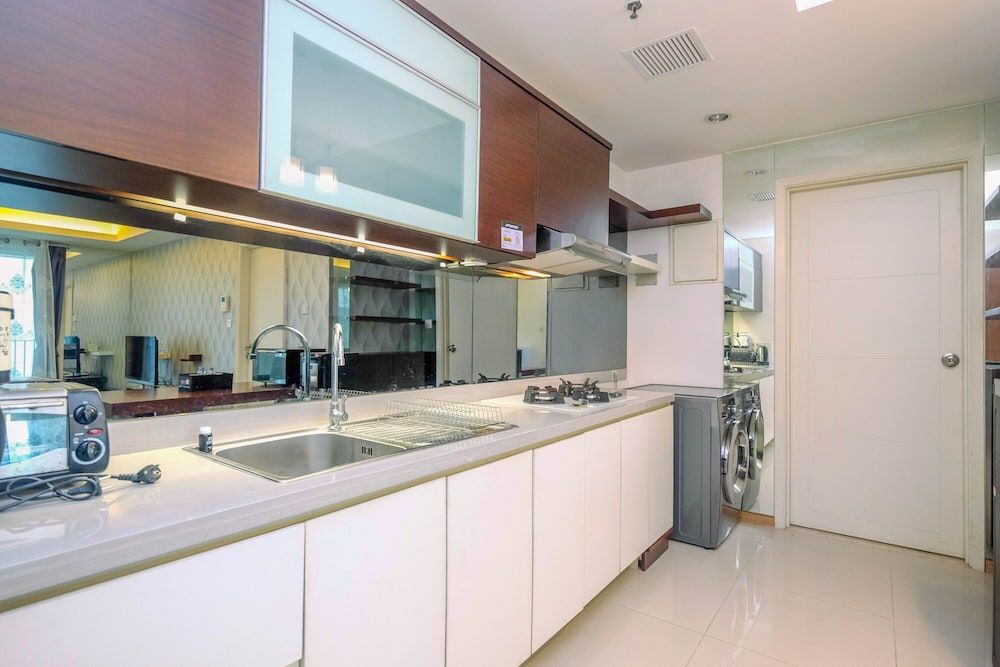 undefined Minimalist Furnished 1BR Apartment at Casa Grande Residence 10