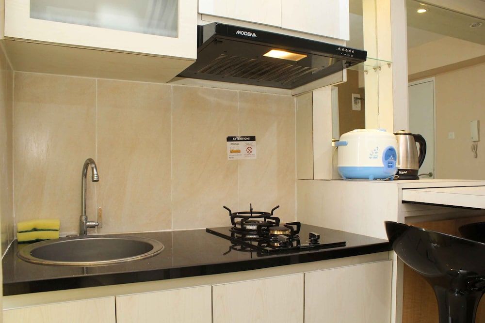 Minimalist and Warm 2BR Bassura City Apartment Room 5