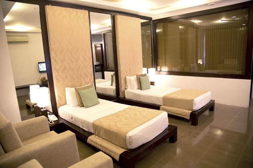 The Tourmaline Deluxe Triple Room