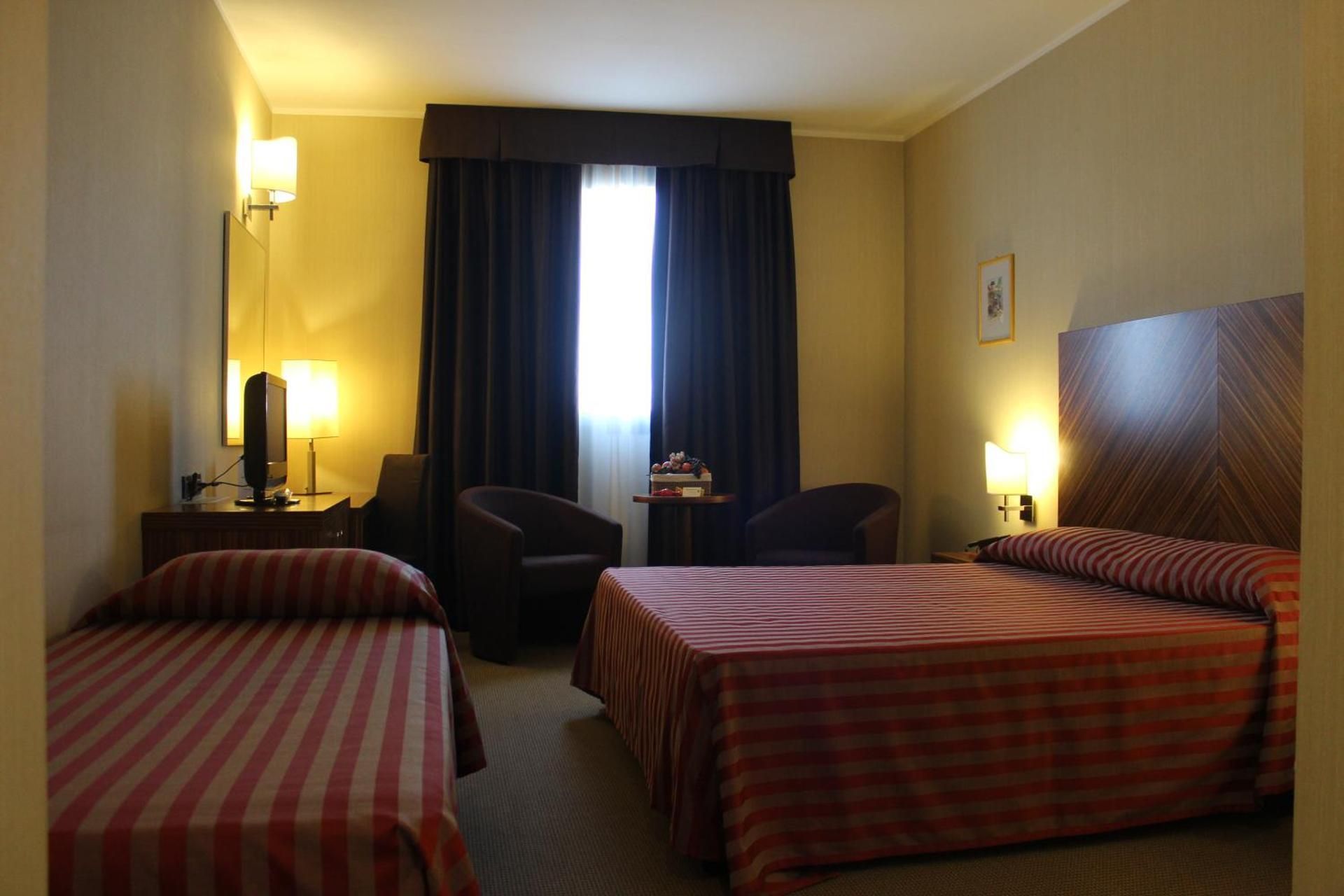 Triple Room (1 Double Bed + 1 Single Bed)