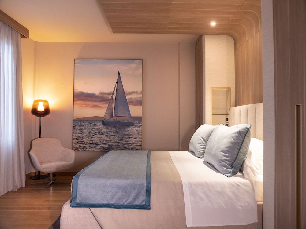 Miramare Suites One-Bedroom Suite with Balcony and Sea View of the Baia delle Favole