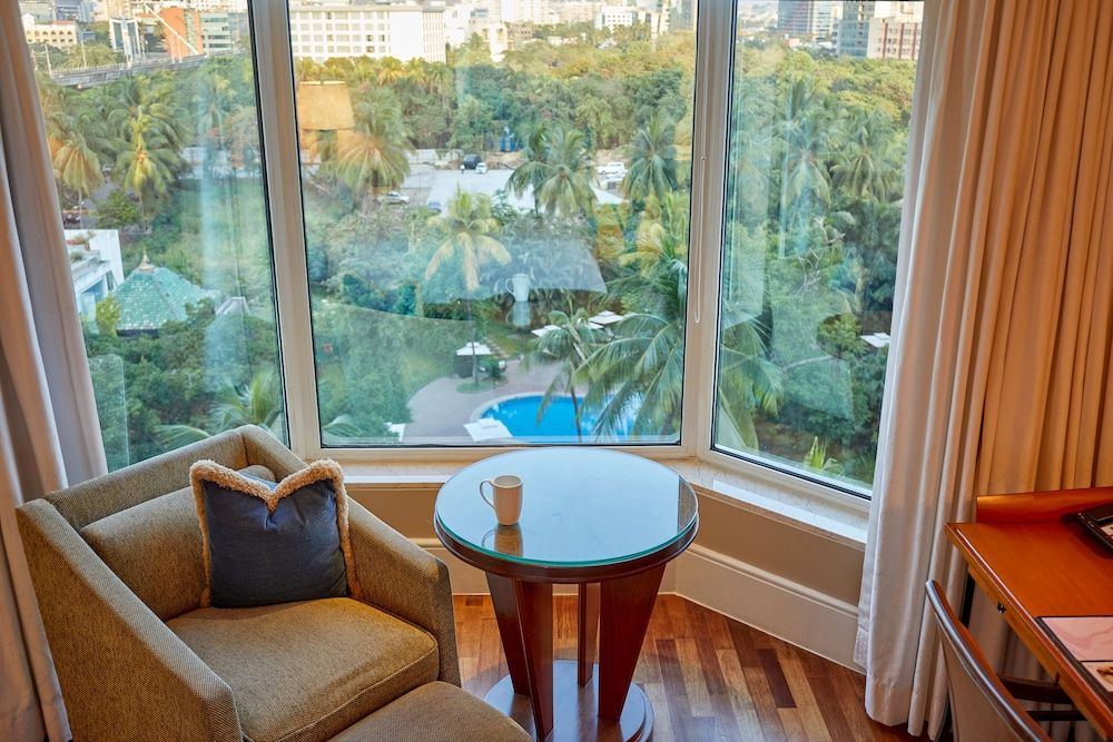 The Leela Mumbai Premier Room Pool View With 1+1 Happy hours are from 5pm to 7pm at 6 degrees on selected brands 2