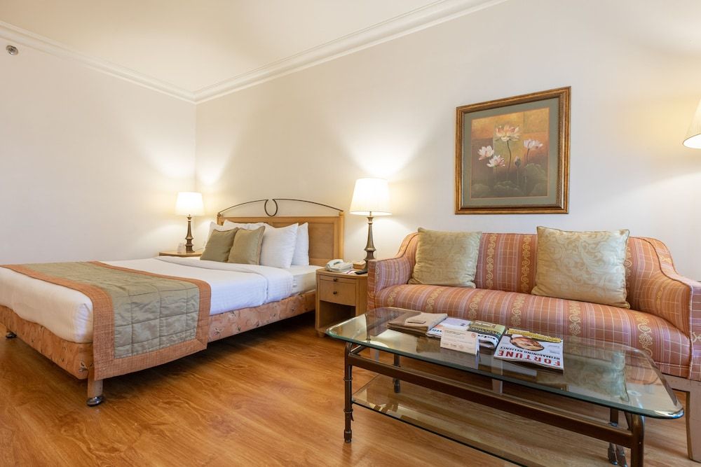 The Orchid Hotel Mumbai Vile Parle Deluxe Room City View King Bed with Bathtub 3