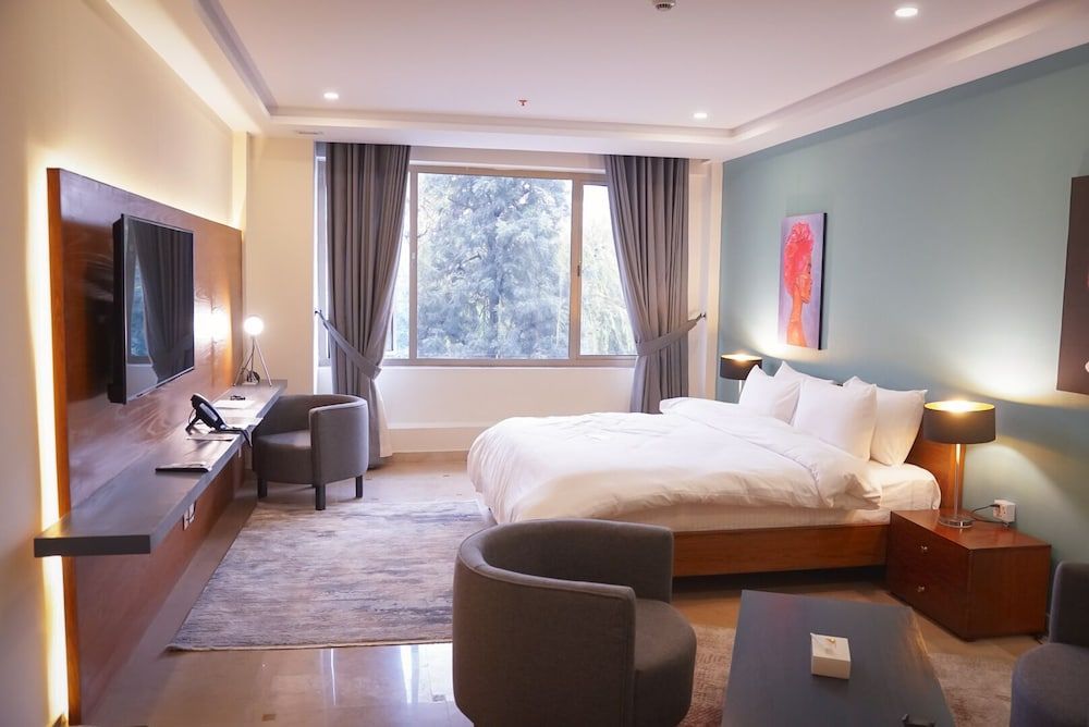 Roomy Signature Hotel Deluxe Double Room 6