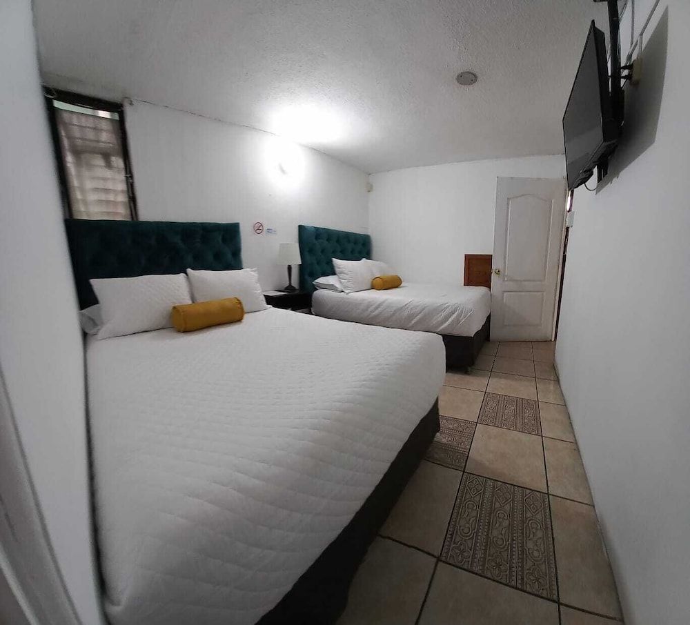 Economy Quadruple Room, 2 Double Beds, Non Smoking, Private Bathroom