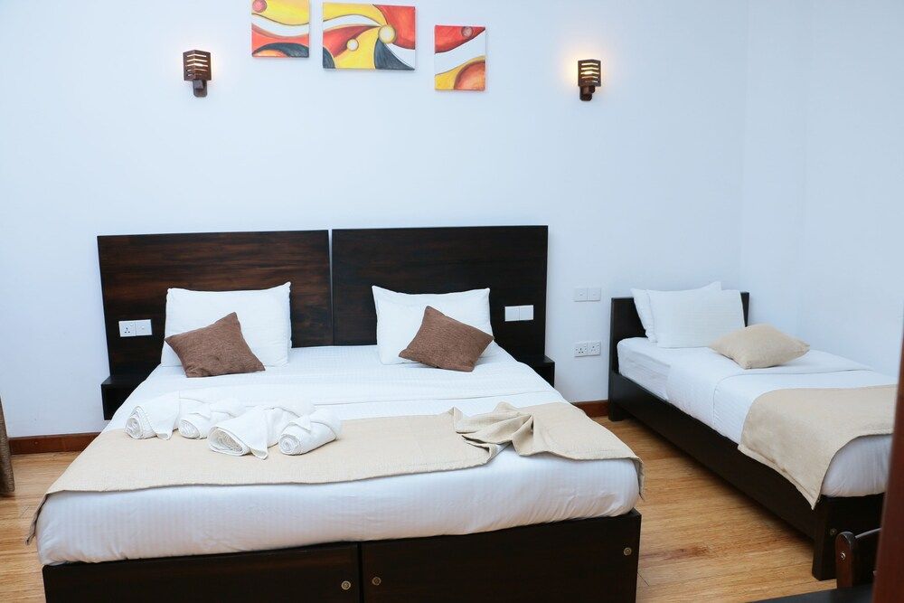 Ruvidee Villa Deluxe Triple Room 5