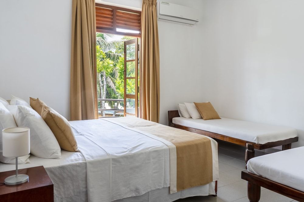 Deluxe Quadruple Room, 1 Bedroom, Balcony, Pool View