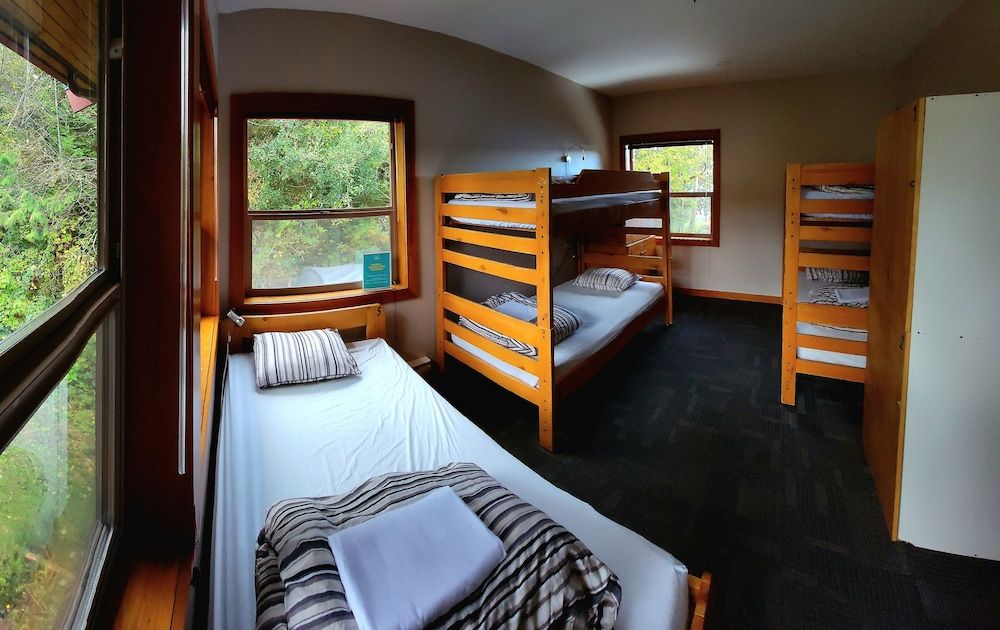 Private room with 5 single beds and shared bathrooms