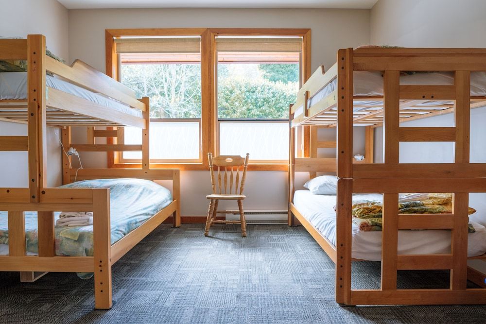 Private room with ocean view, 2-piece bathroom, shared showers - accessible