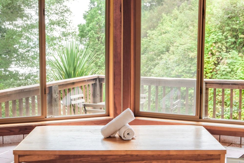 Private room with full bathroom, balcony and cove views