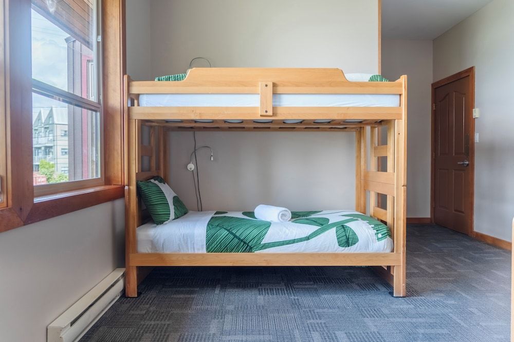 Private room with ocean view, 2-piece bathroom, shared showers - accessible