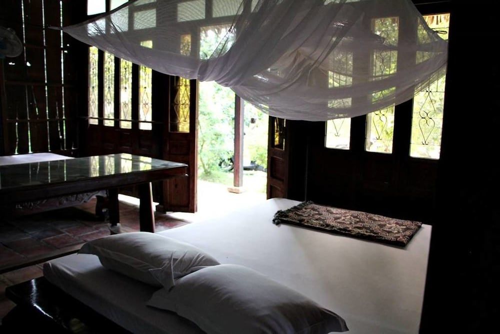 Nhon Thanh Homestay Quadruple Room, Garden View 5