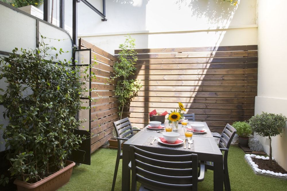 Under the shade of Acropolis Apartment, Patio 13