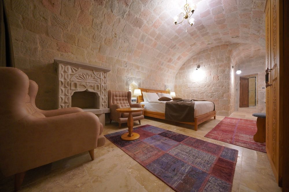 Cappadocia Secret Hill Cave Suites Deluxe Arch Room With Fireplace 11