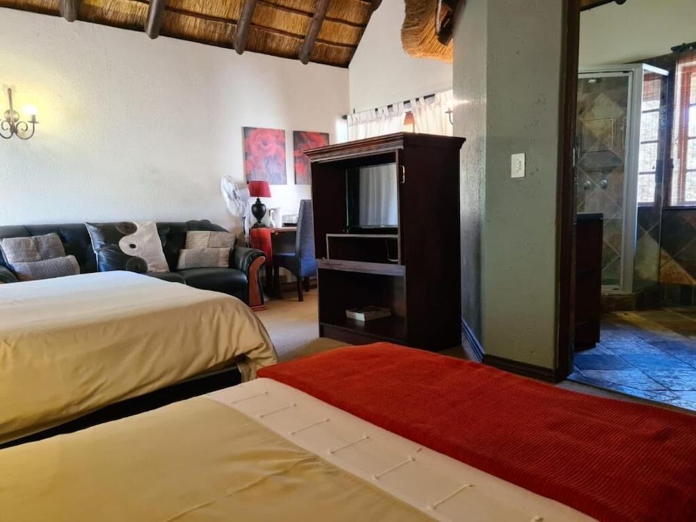 Khaya Africa Guesthouse and Spa Executive Quadruple Room, Multiple Beds, Balcony, Garden View 3