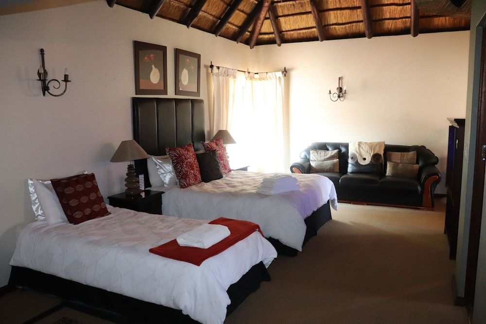 Khaya Africa Guesthouse and Spa Executive Quadruple Room, Multiple Beds, Balcony, Garden View 2