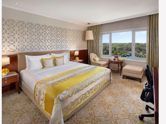 Deluxe Room King Bed Forest and Pool View