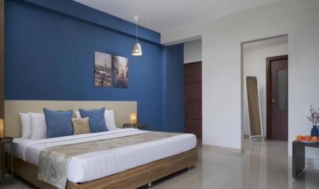 Grandeur Stays Deluxe Double Room