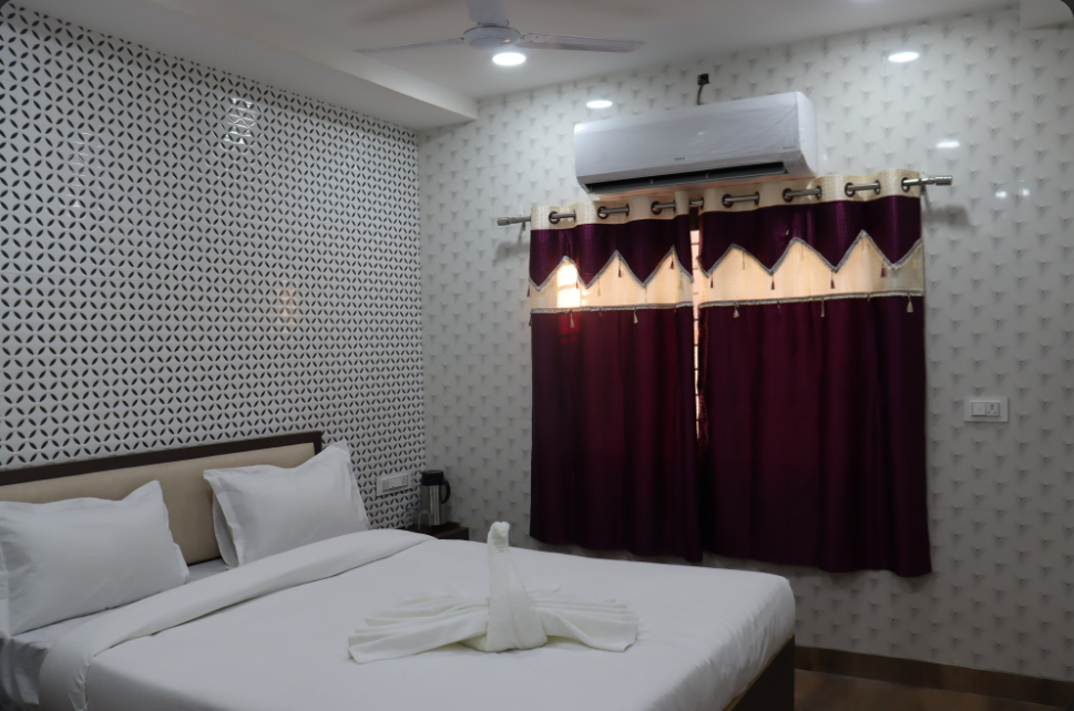 N K Excellency Deluxe Room 9