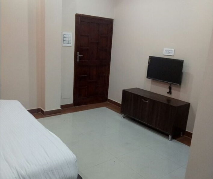 Sweet Basil Hotel and Restaurant Deluxe Room Non AC 3