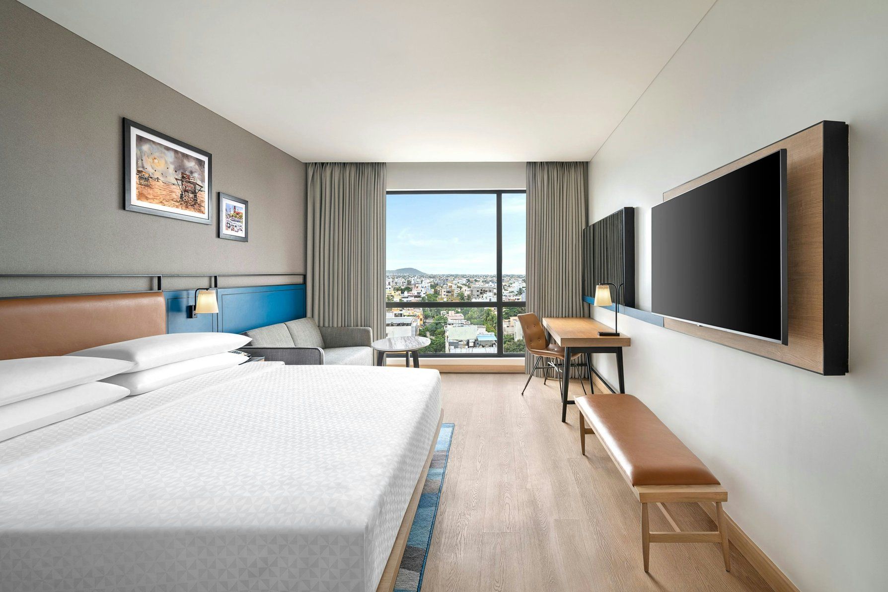 Guest room with a king-sized bed, flat-screened TV