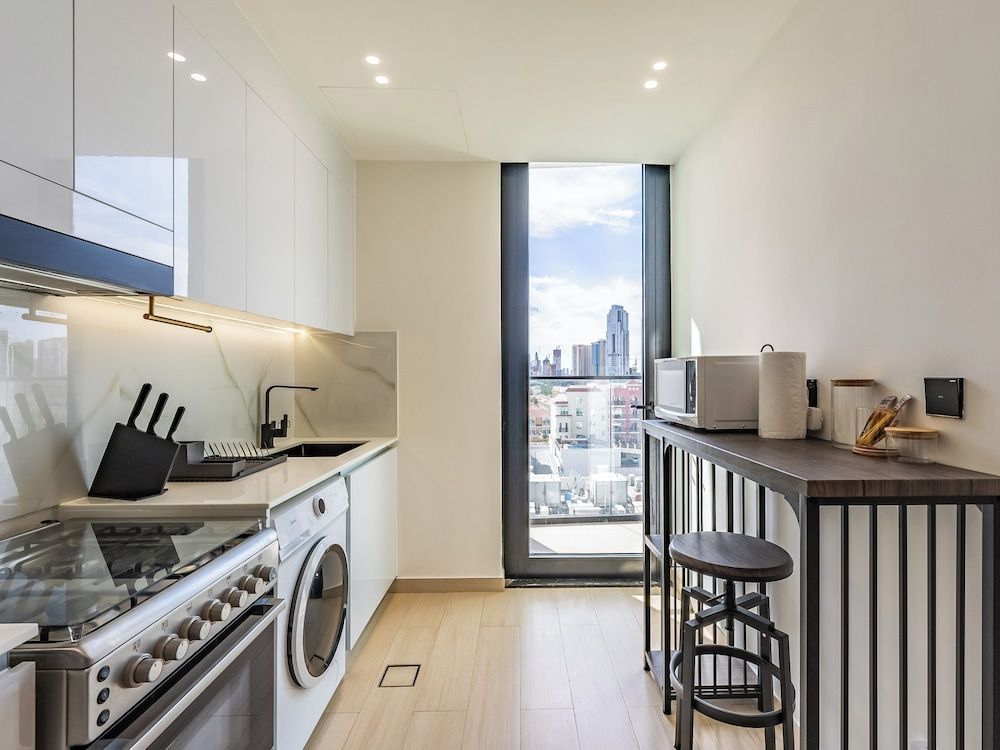 Apt with Artful Interior and Urban Views