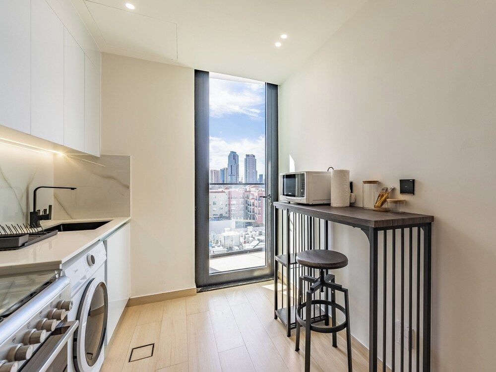Apt with Artful Interior and Urban Views