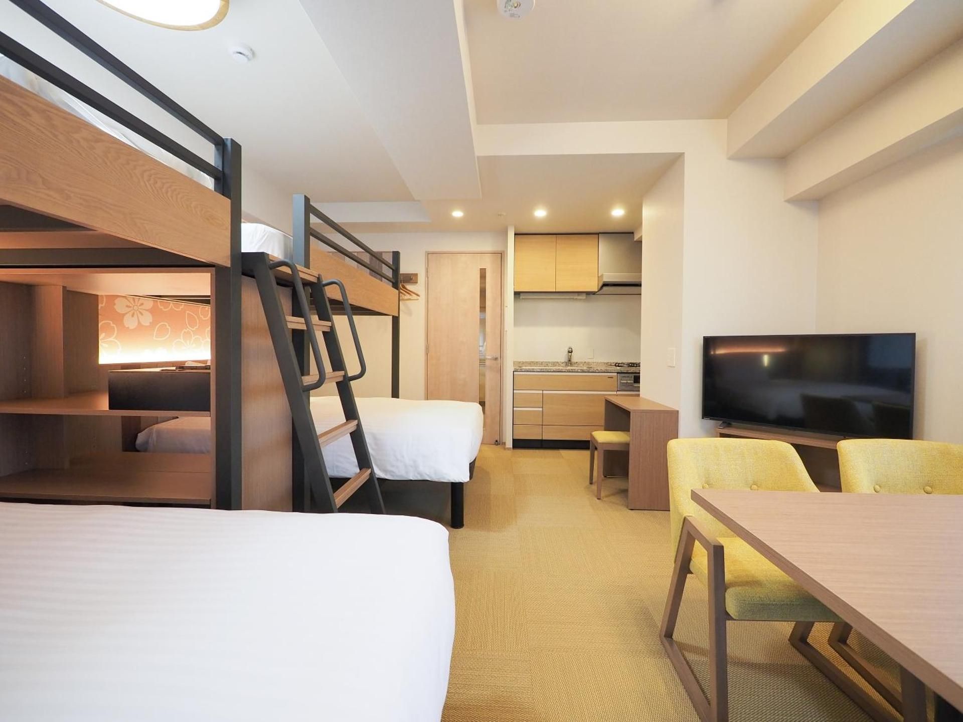 Family Room with Twin Beds and Loft Beds and Kitchen and Washing Machine