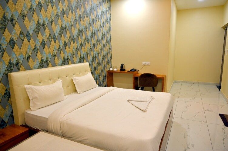 Deluxe Room (Free Pickup and Drop from Railway Station or Bus Stand)