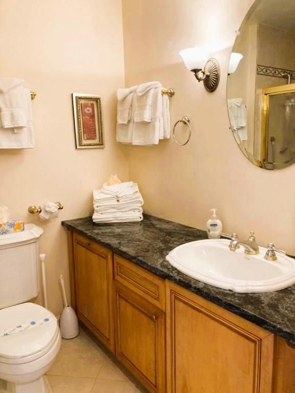 Two-Bedroom Suite with Kitchen, Balcony, and Partial Ocean View  2B