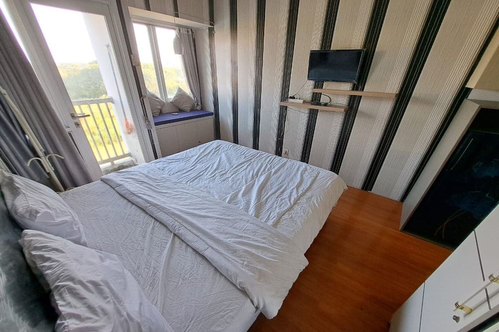 OYO Life 93106 Apartement Grand Sentraland By Andi Deluxe Double Room 13