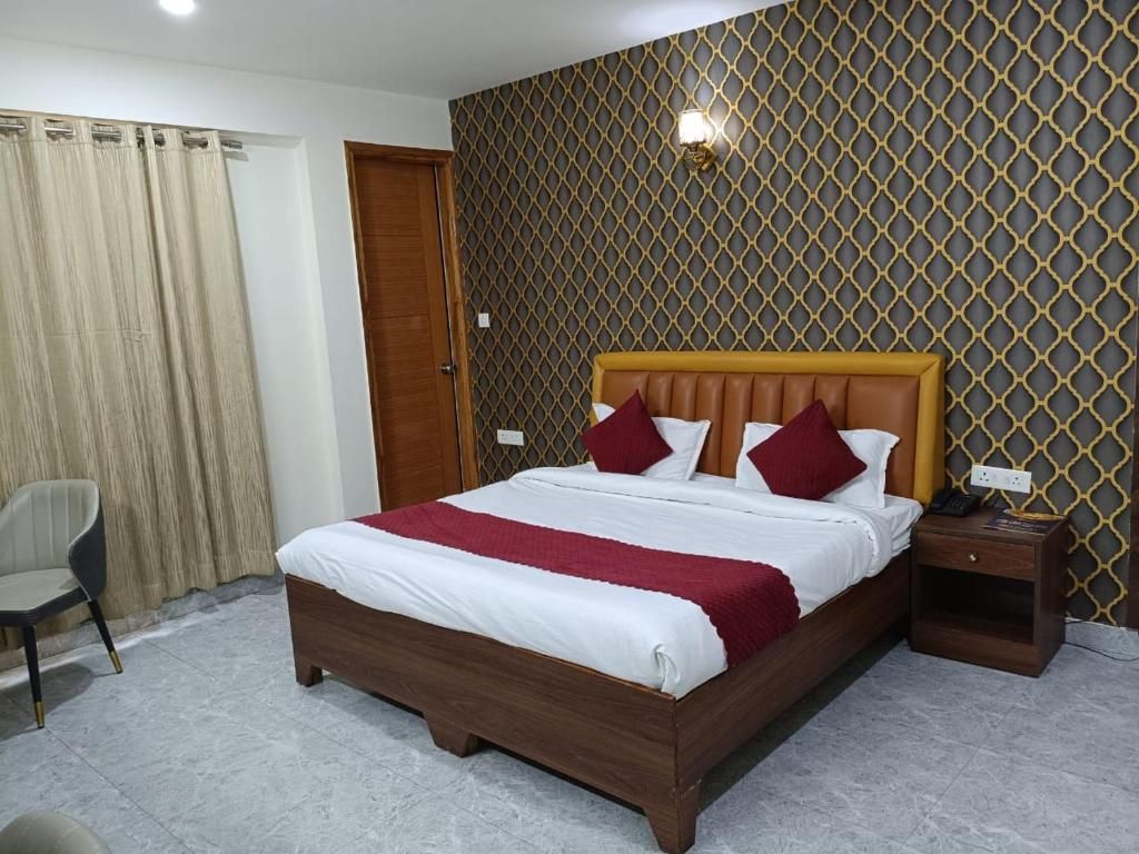 Divine Hotels & Banquets Deluxe Room 6
