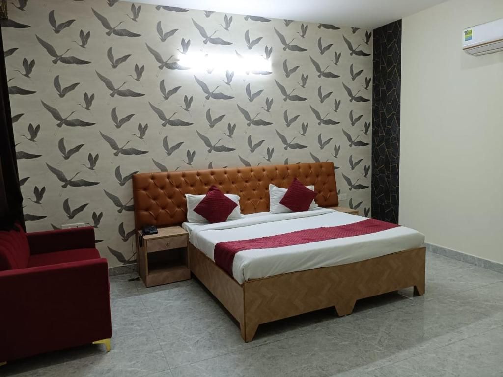 Divine Hotels & Banquets Deluxe Room 5